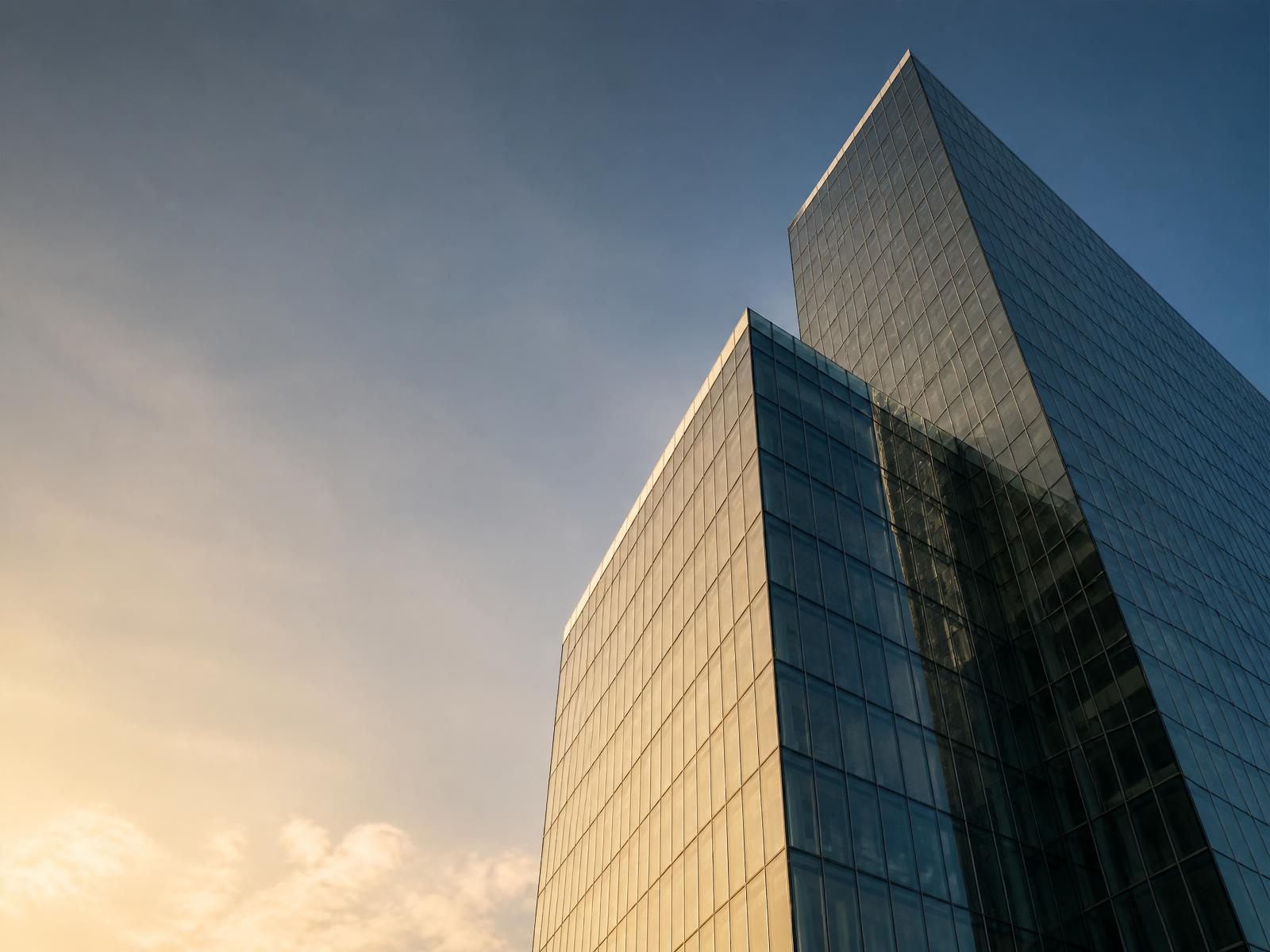 Modern commercial office tower at golden hour